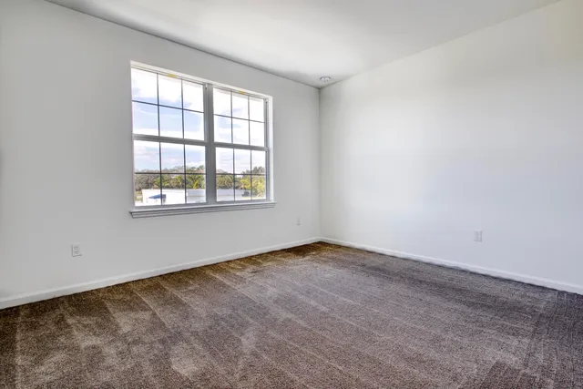 a bathroom with a bathtub shower sink vanity and toilet