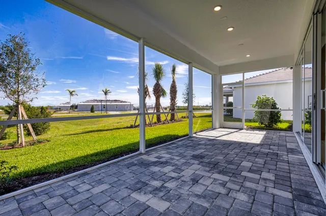 a view of a house with backyard and pool