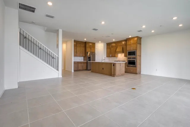 a view of a kitchen with a sink and microwave