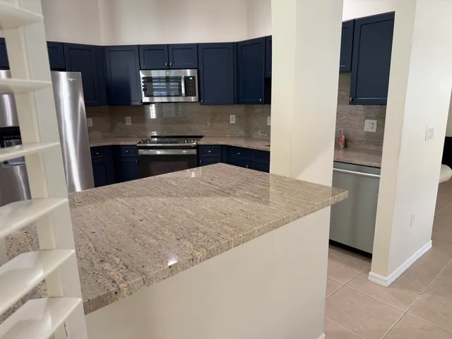 a view of a yard with potted plants