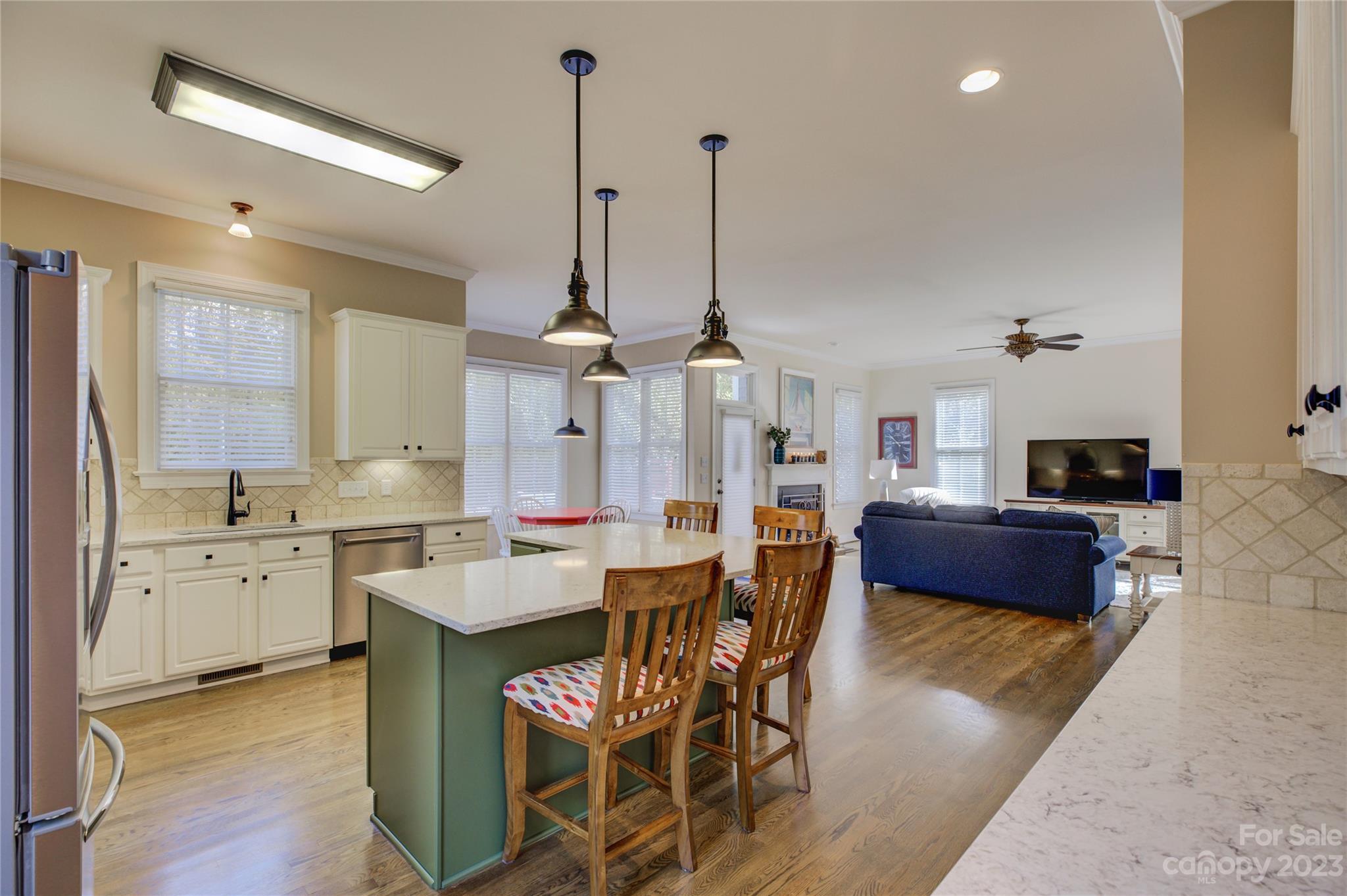 7124 Michael Scott Crossing Fort Mill, SC 29708 - Photo 11 of 48 a large kitchen with kitchen island a large island in the center