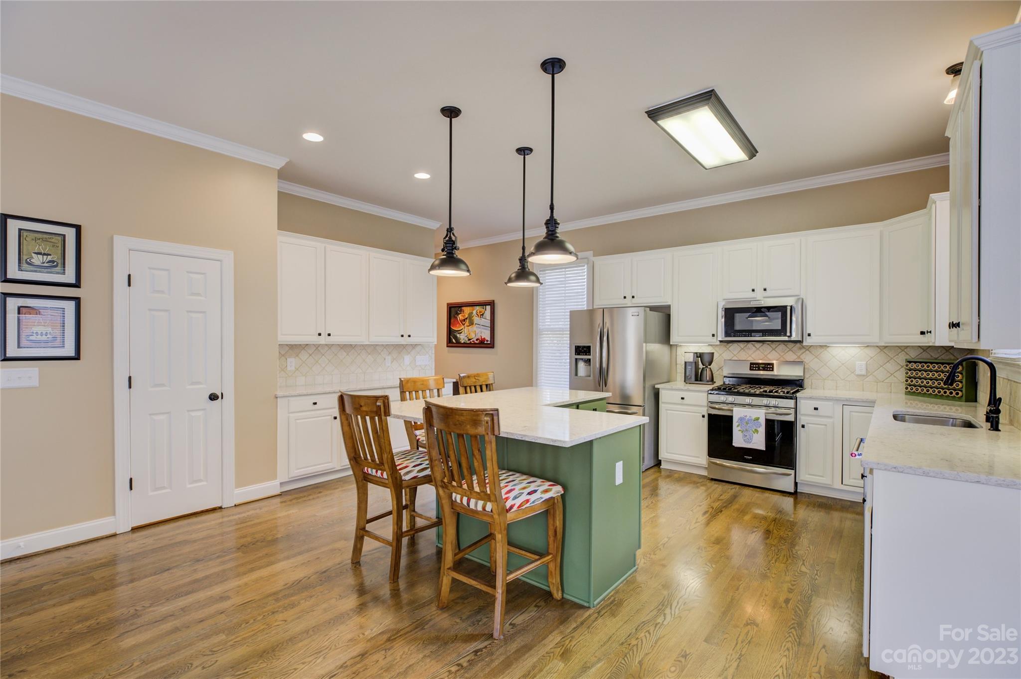 7124 Michael Scott Crossing Fort Mill, SC 29708 - Photo 13 of 48 a view of a kitchen with microwave and cabinets