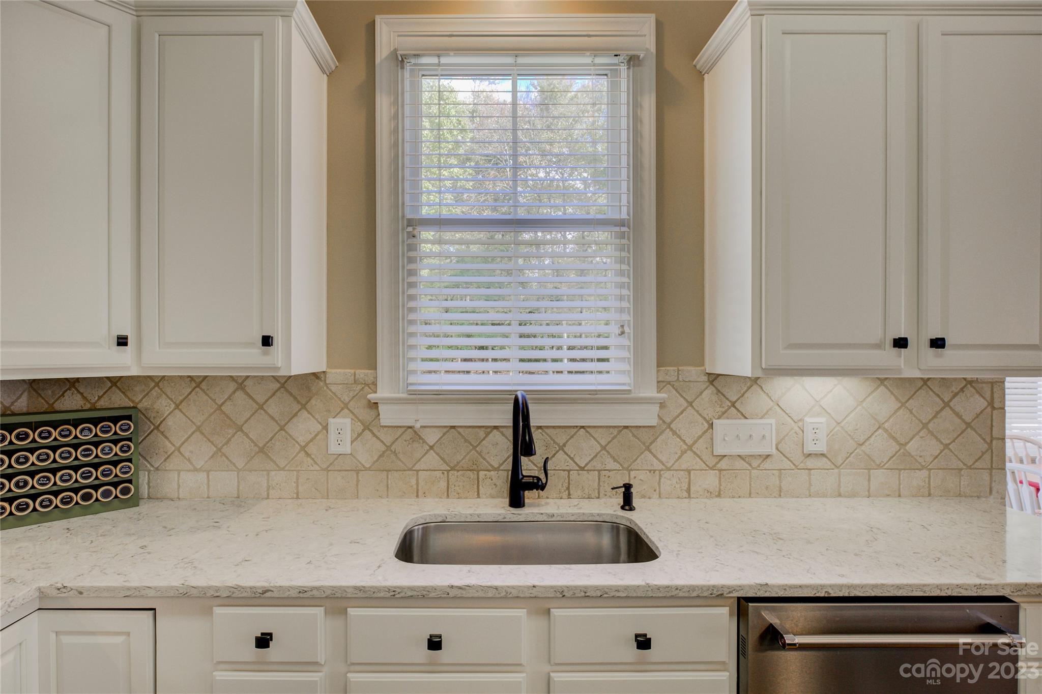 7124 Michael Scott Crossing Fort Mill, SC 29708 - Photo 15 of 48 a kitchen with a sink and cabinets