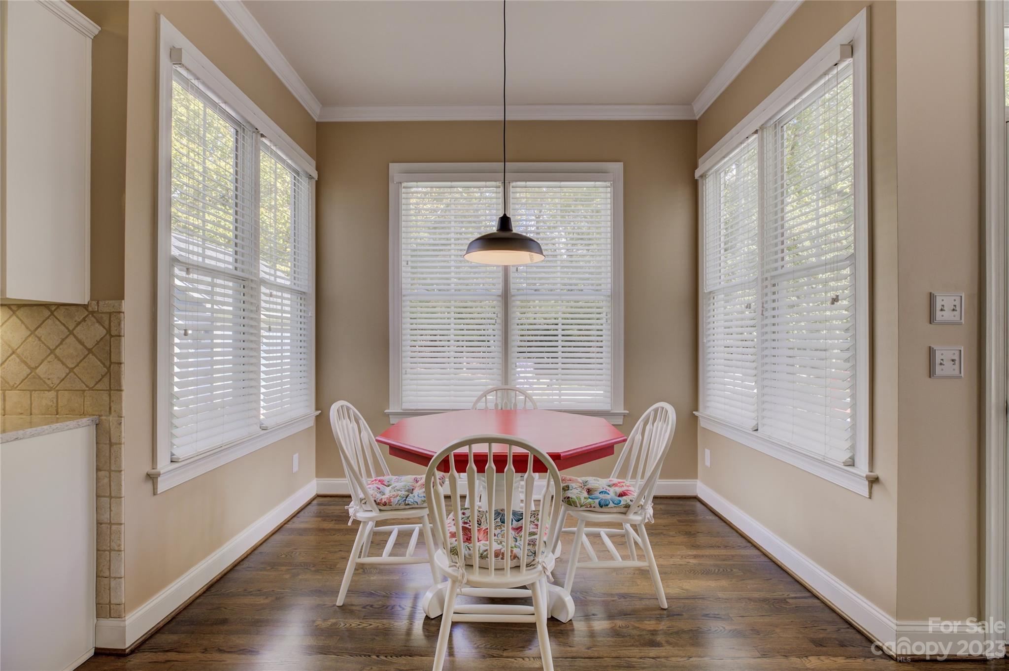 7124 Michael Scott Crossing Fort Mill, SC 29708 - Photo 16 of 48 a view of a dining room with furniture window and wooden floor