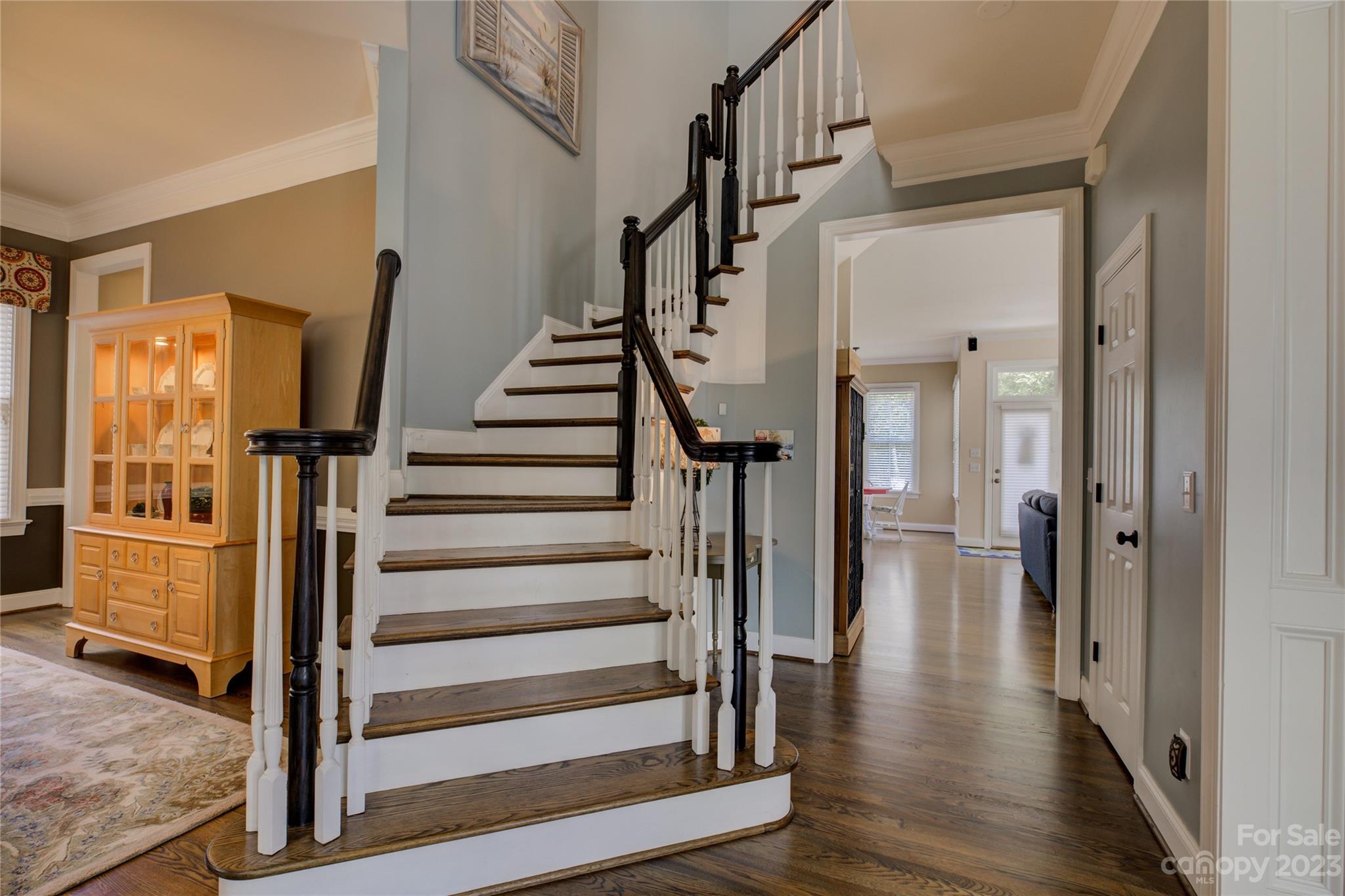 7124 Michael Scott Crossing Fort Mill, SC 29708 - Photo 23 of 48 a view of an entryway with wooden floor and staircase