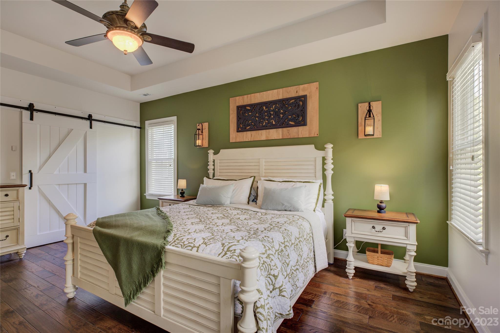 7124 Michael Scott Crossing Fort Mill, SC 29708 - Photo 25 of 48 a bedroom with a bed and a chandelier