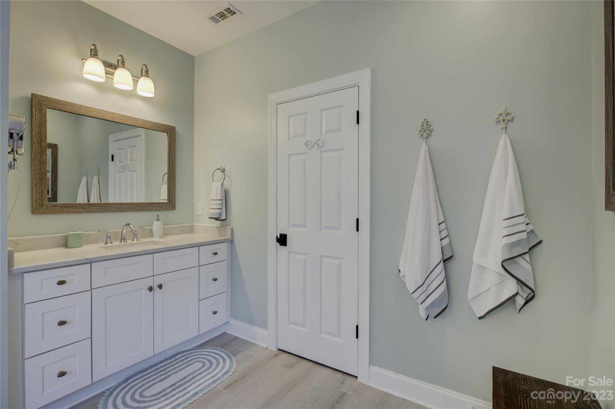 7124 Michael Scott Crossing Fort Mill, SC 29708 - Photo 27 of 48 a bathroom with double vanity sink a vanity and a mirror
