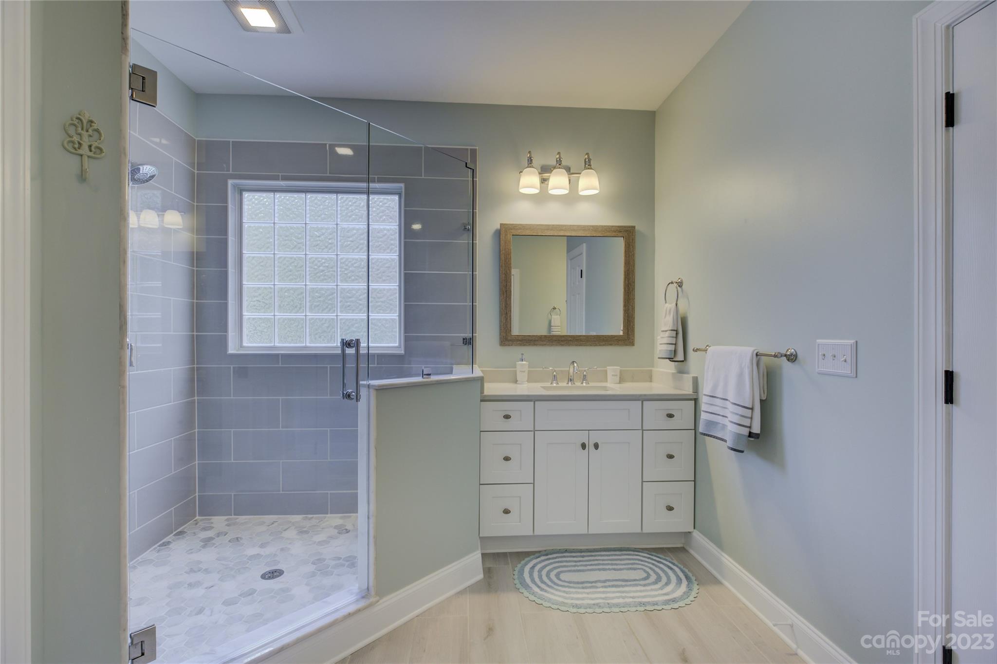 7124 Michael Scott Crossing Fort Mill, SC 29708 - Photo 28 of 48 a bathroom with a sink a toilet and shower