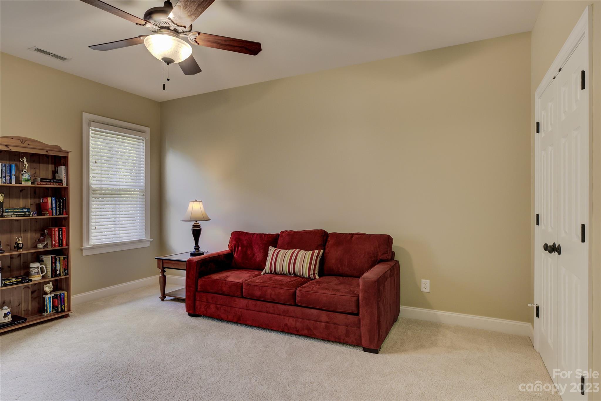 7124 Michael Scott Crossing Fort Mill, SC 29708 - Photo 30 of 48 a living room with furniture and a chandelier