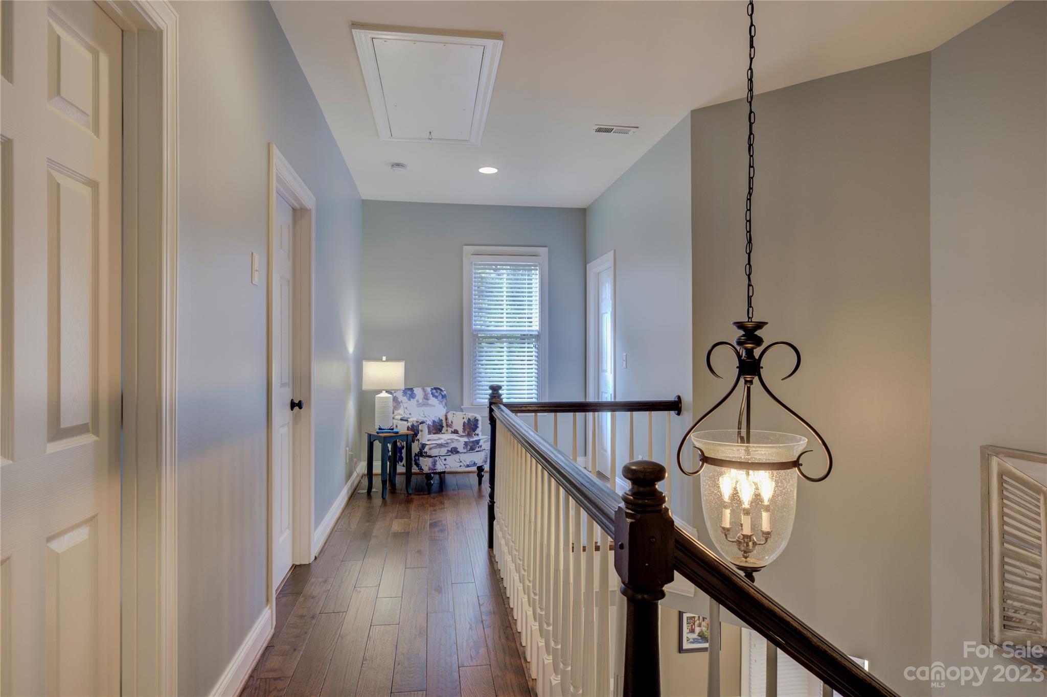 7124 Michael Scott Crossing Fort Mill, SC 29708 - Photo 33 of 48 a view of a hallway with wooden floor and staircase