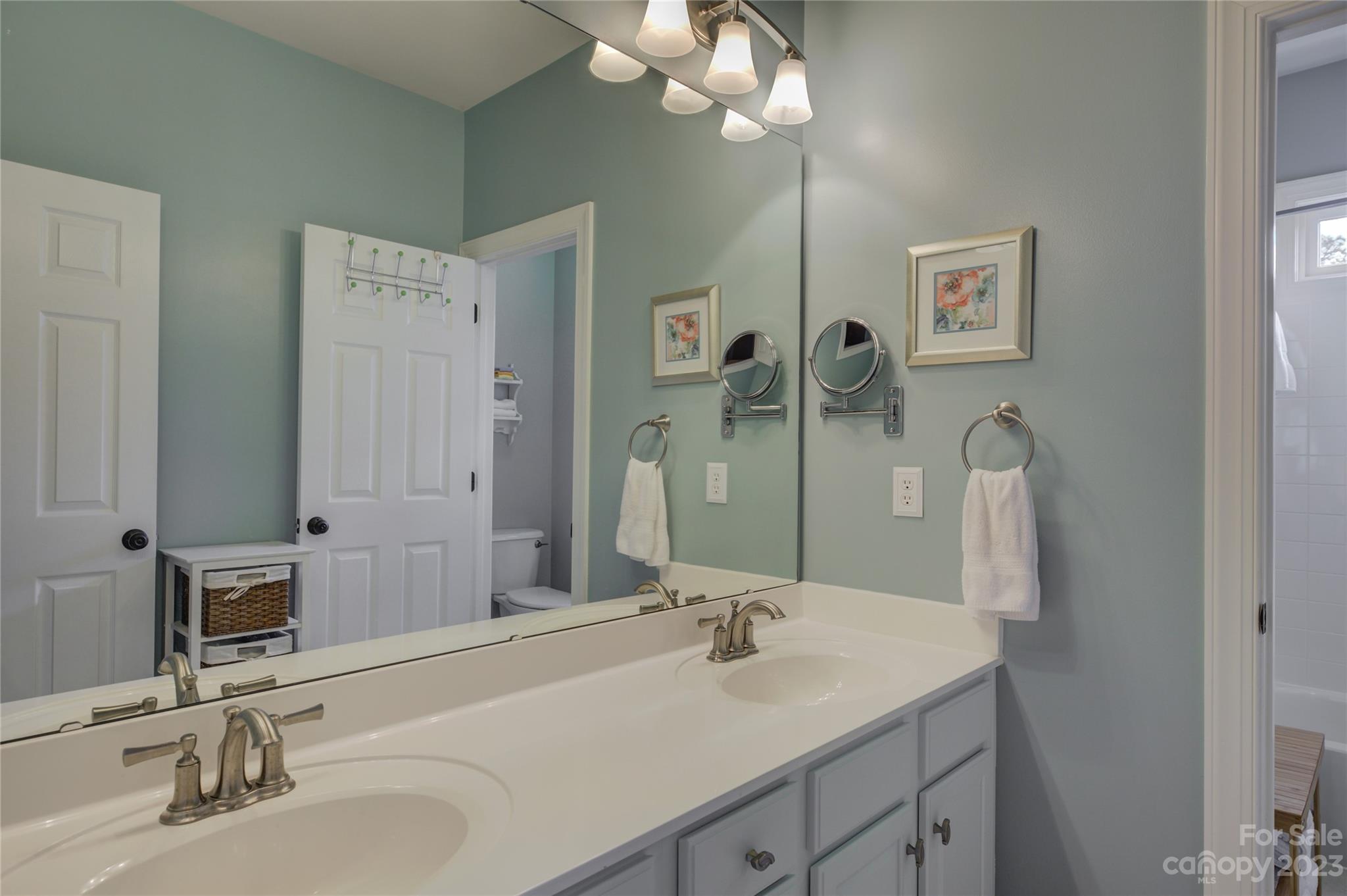7124 Michael Scott Crossing Fort Mill, SC 29708 - Photo 34 of 48 a bathroom with a sink and a mirror
