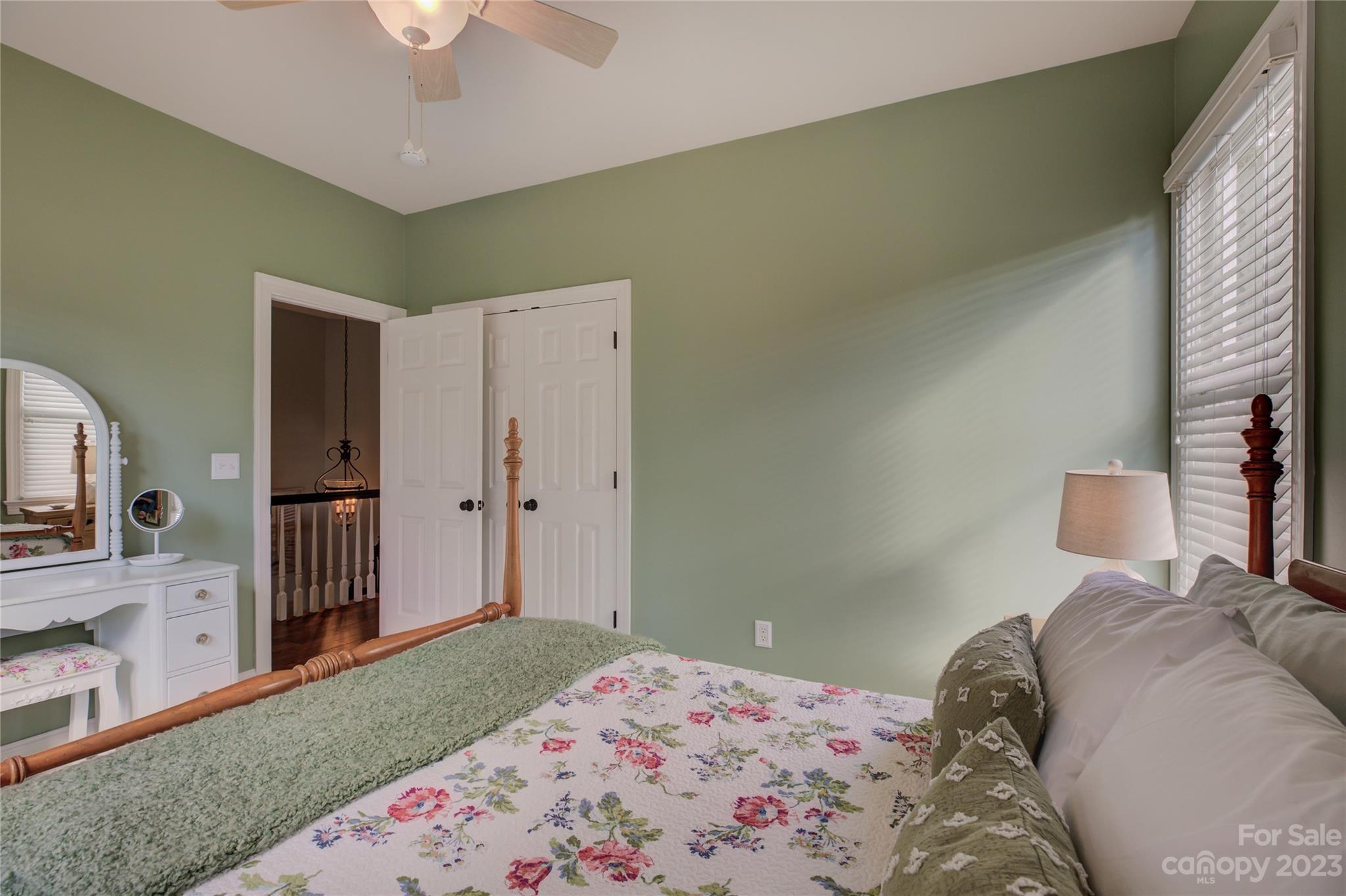 7124 Michael Scott Crossing Fort Mill, SC 29708 - Photo 37 of 48 a bedroom with a bed and a flat tv screen on dresser