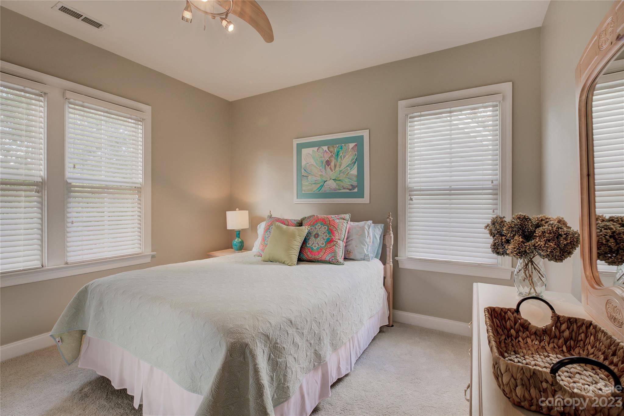 7124 Michael Scott Crossing Fort Mill, SC 29708 - Photo 39 of 48 a bedroom with a bed and windows