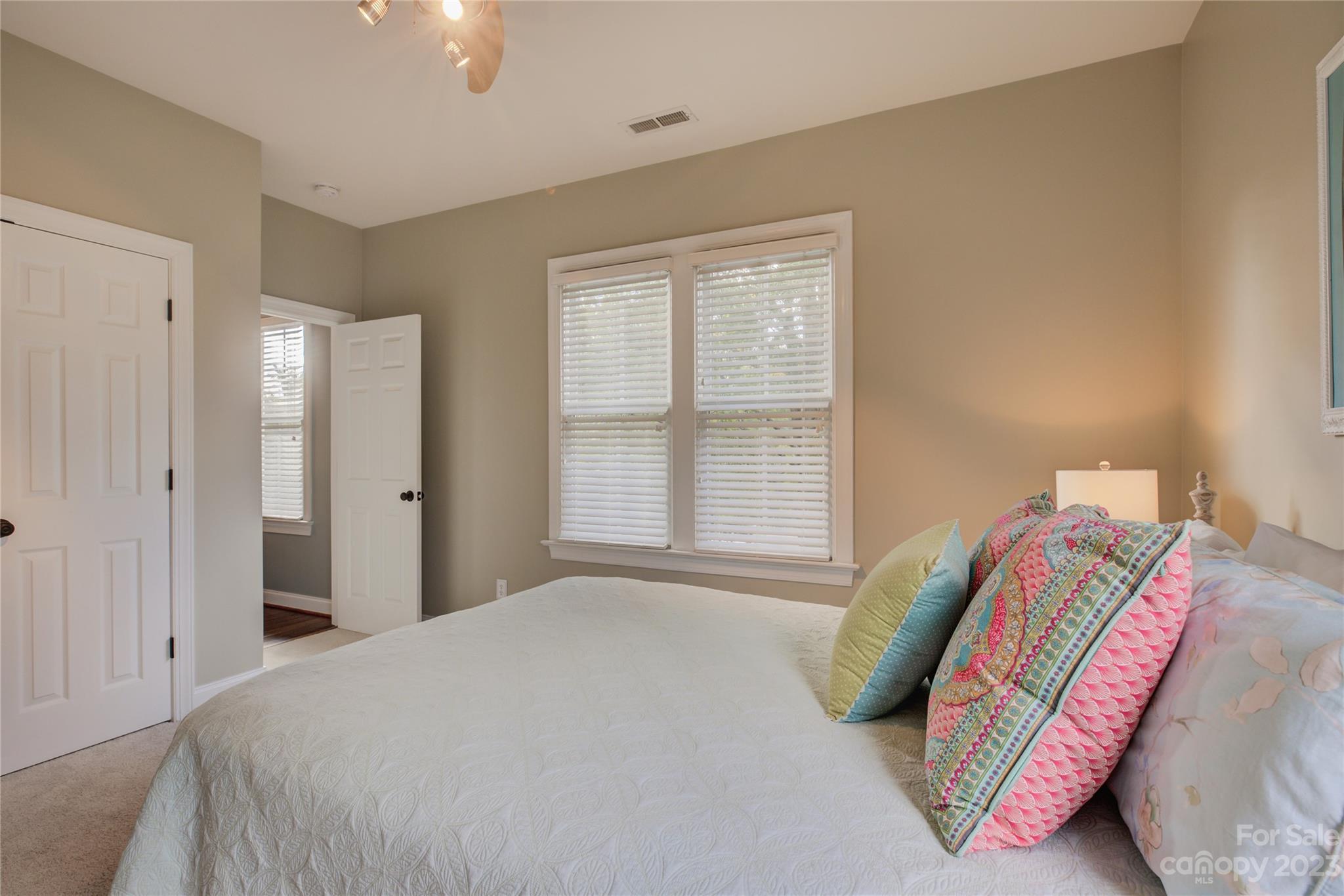 7124 Michael Scott Crossing Fort Mill, SC 29708 - Photo 40 of 48 a bedroom with a bed and a window