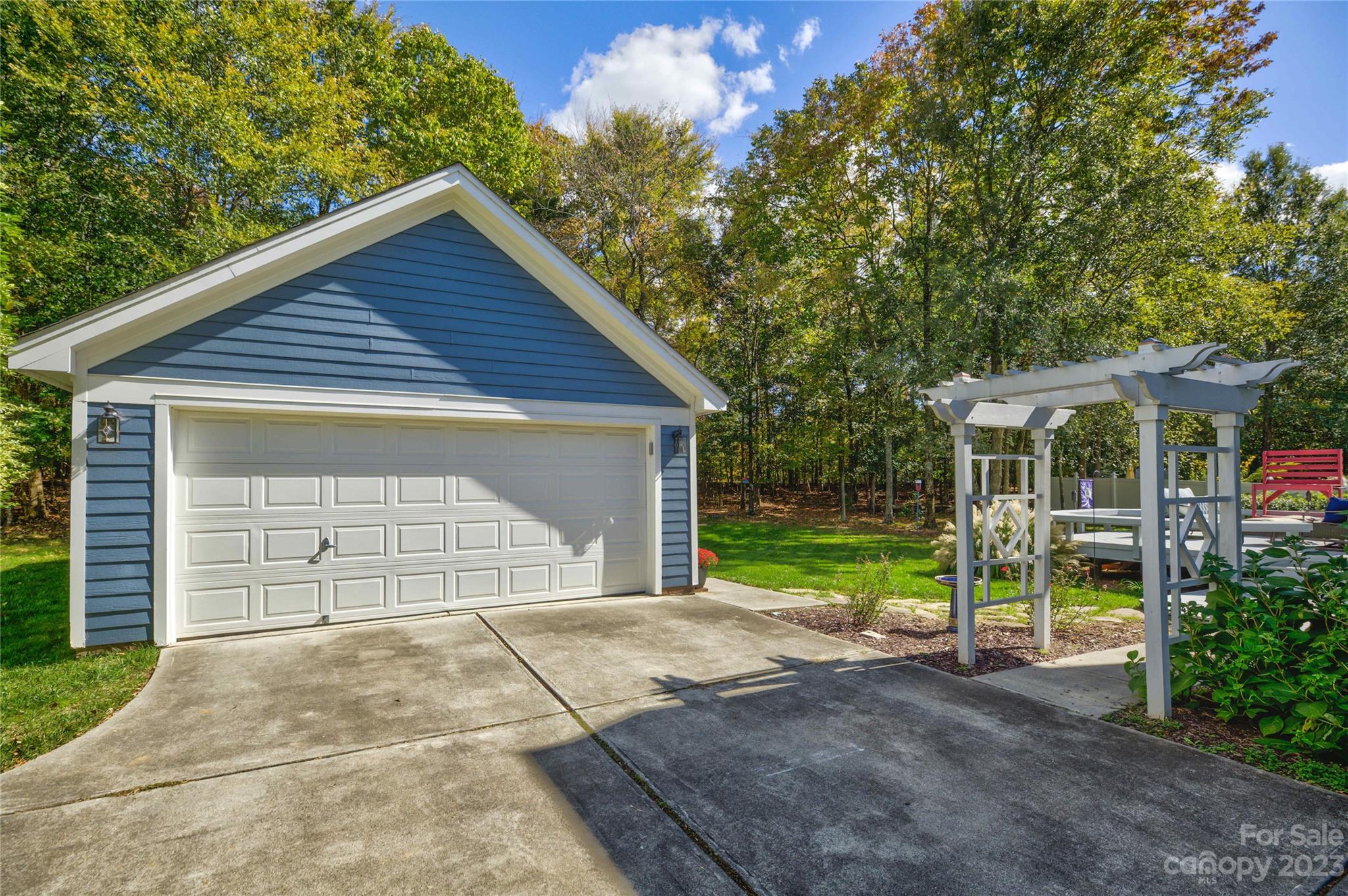 7124 Michael Scott Crossing Fort Mill, SC 29708 - Photo 41 of 48 a view of backyard with large trees and wooden fence