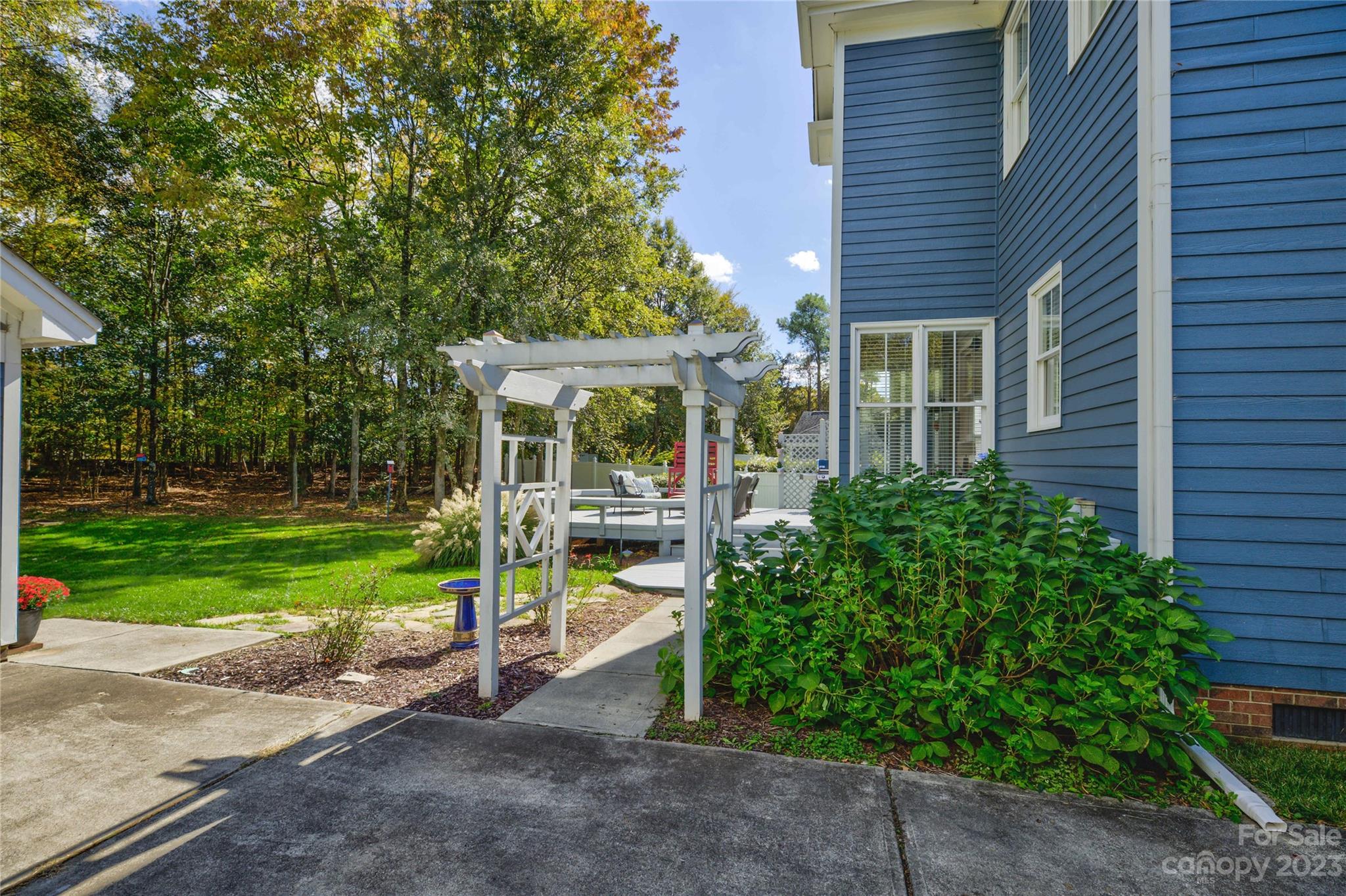 7124 Michael Scott Crossing Fort Mill, SC 29708 - Photo 42 of 48 a view of a house with backyard and a garden