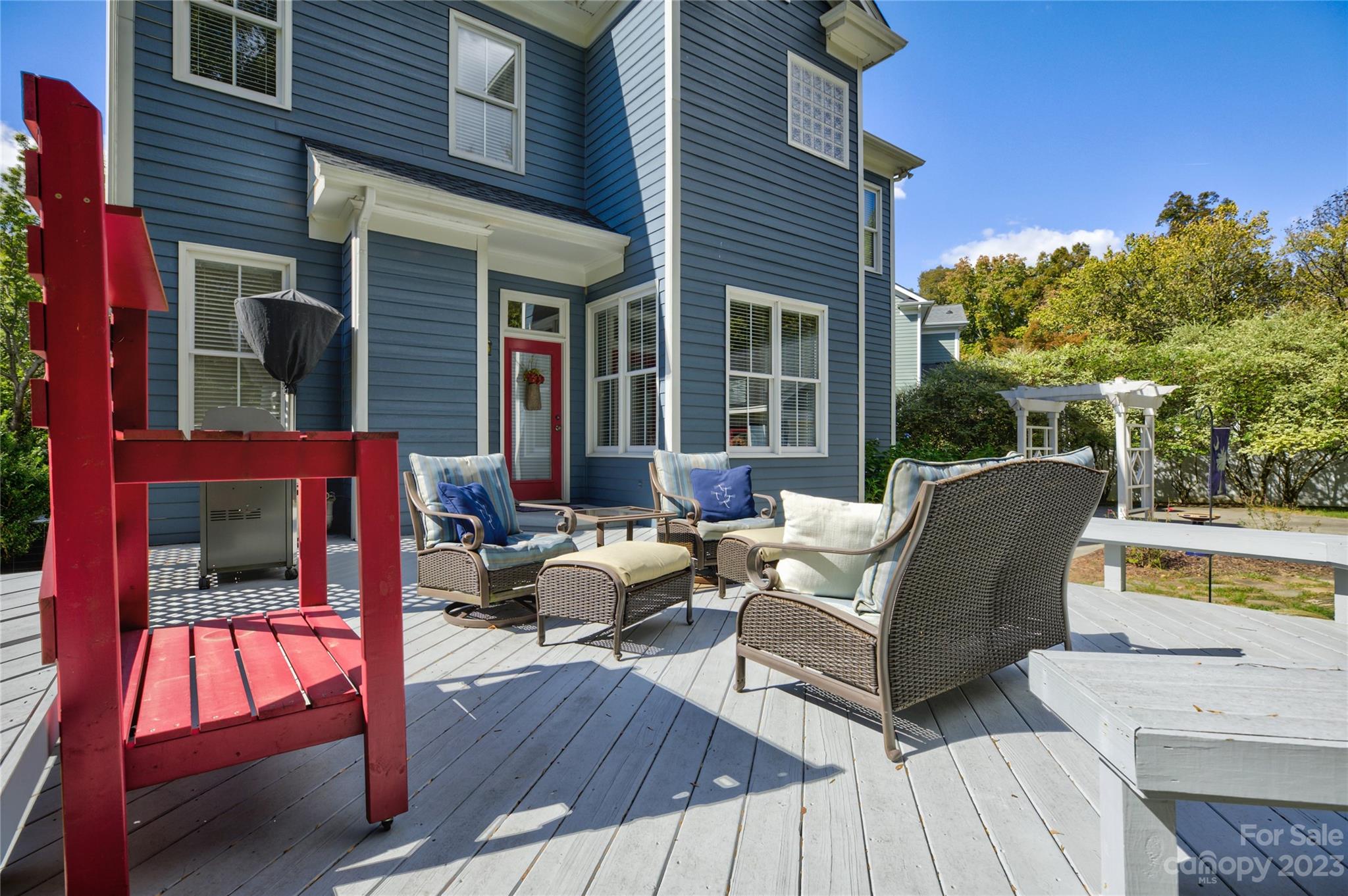 7124 Michael Scott Crossing Fort Mill, SC 29708 - Photo 44 of 48 a view of a deck with table and chairs and wooden floor