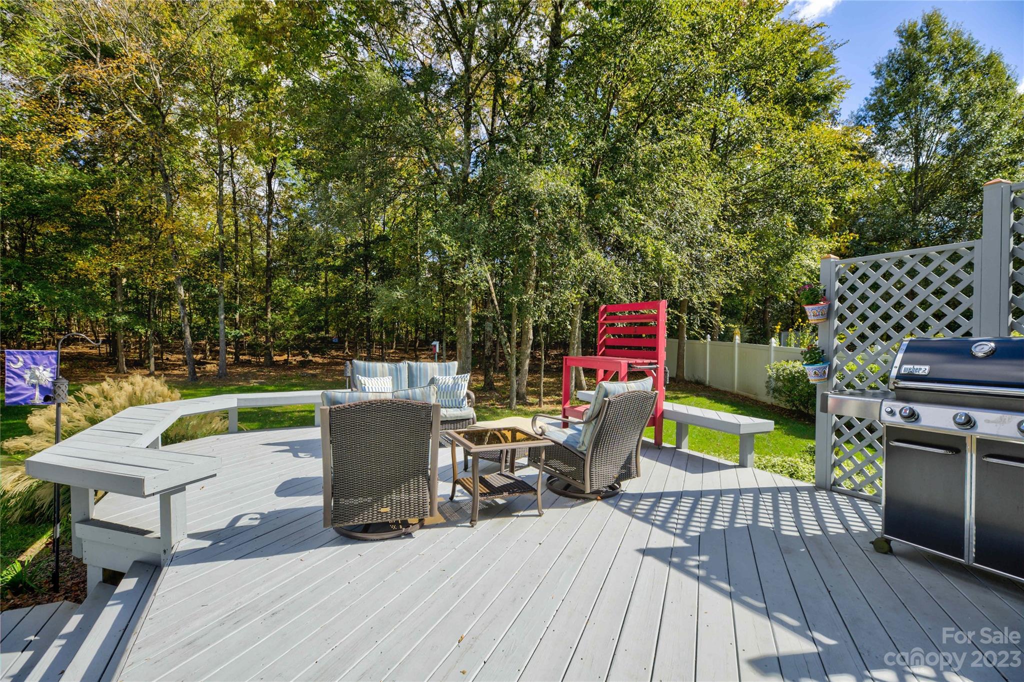 7124 Michael Scott Crossing Fort Mill, SC 29708 - Photo 45 of 48 a view of a deck with furniture a barbeque grill with wooden floor and fence