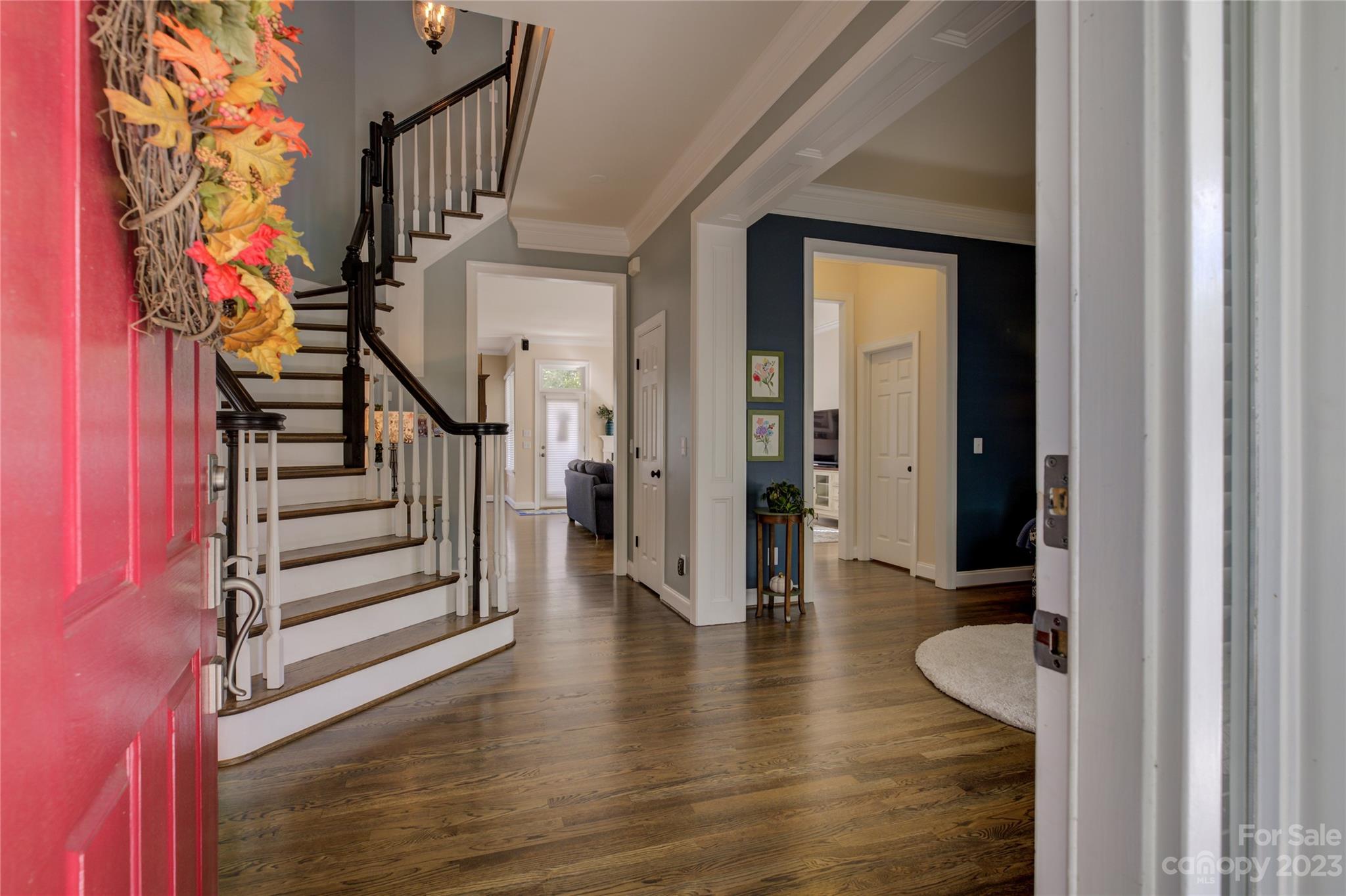 7124 Michael Scott Crossing Fort Mill, SC 29708 - Photo 6 of 48 a view of an entryway with wooden floor and stairs