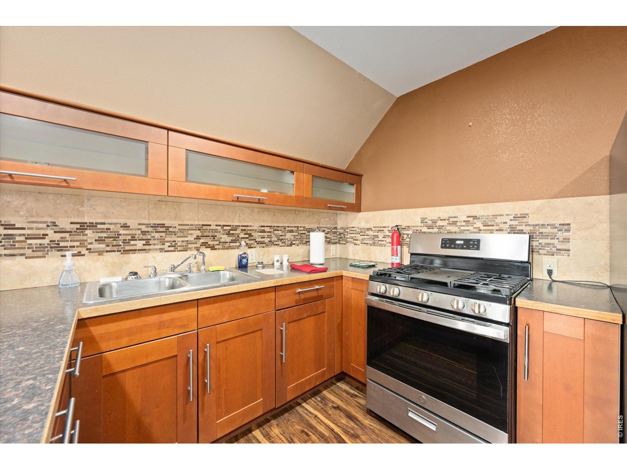 1019 3rd Street Pierce, CO 80650 - Photo 25 of 37 a kitchen with stainless steel appliances granite countertop a stove and a microwave
