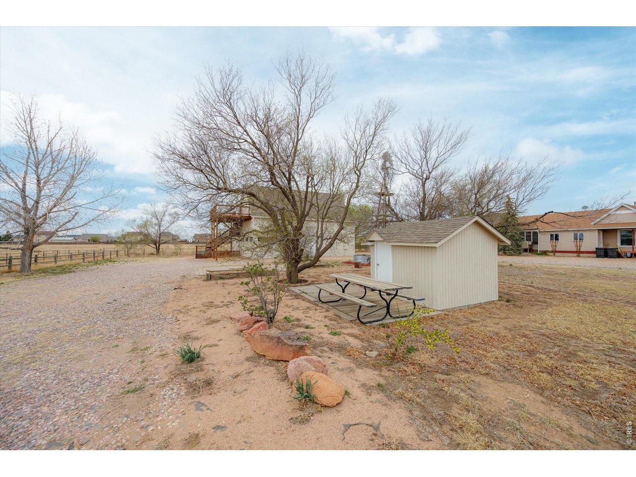 1019 3rd Street Pierce, CO 80650 - Photo 3 of 37 a view of white house with a yard
