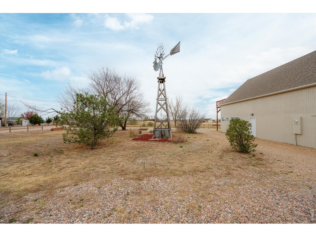 1019 3rd Street Pierce, CO 80650 - Photo 10 of 37 a view of a dry yard with a barn