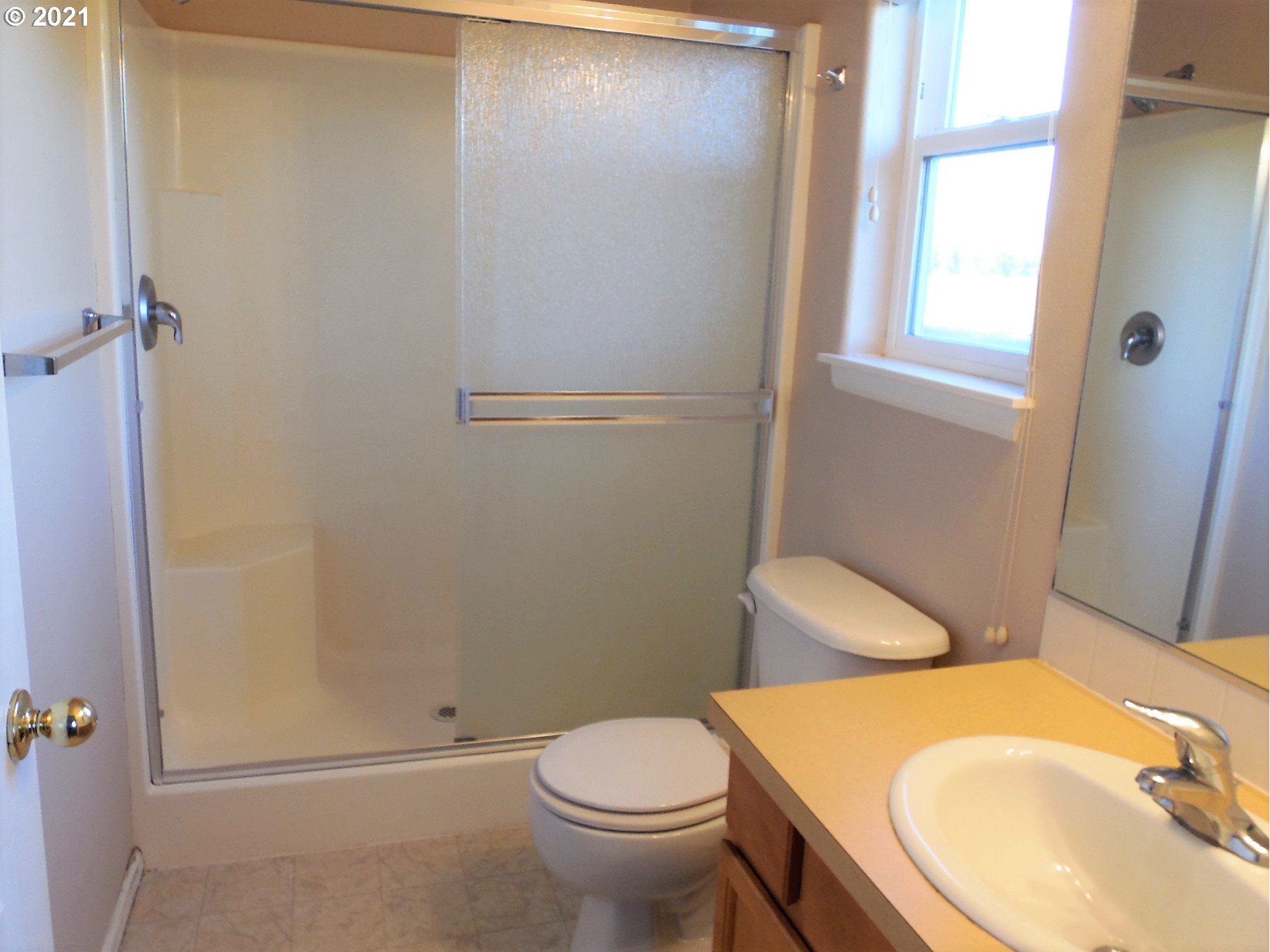 185 Lebleu Lane Winston, OR 97496 - Photo 11 of 23 a white toilet sitting next to a bathroom sink and a tub