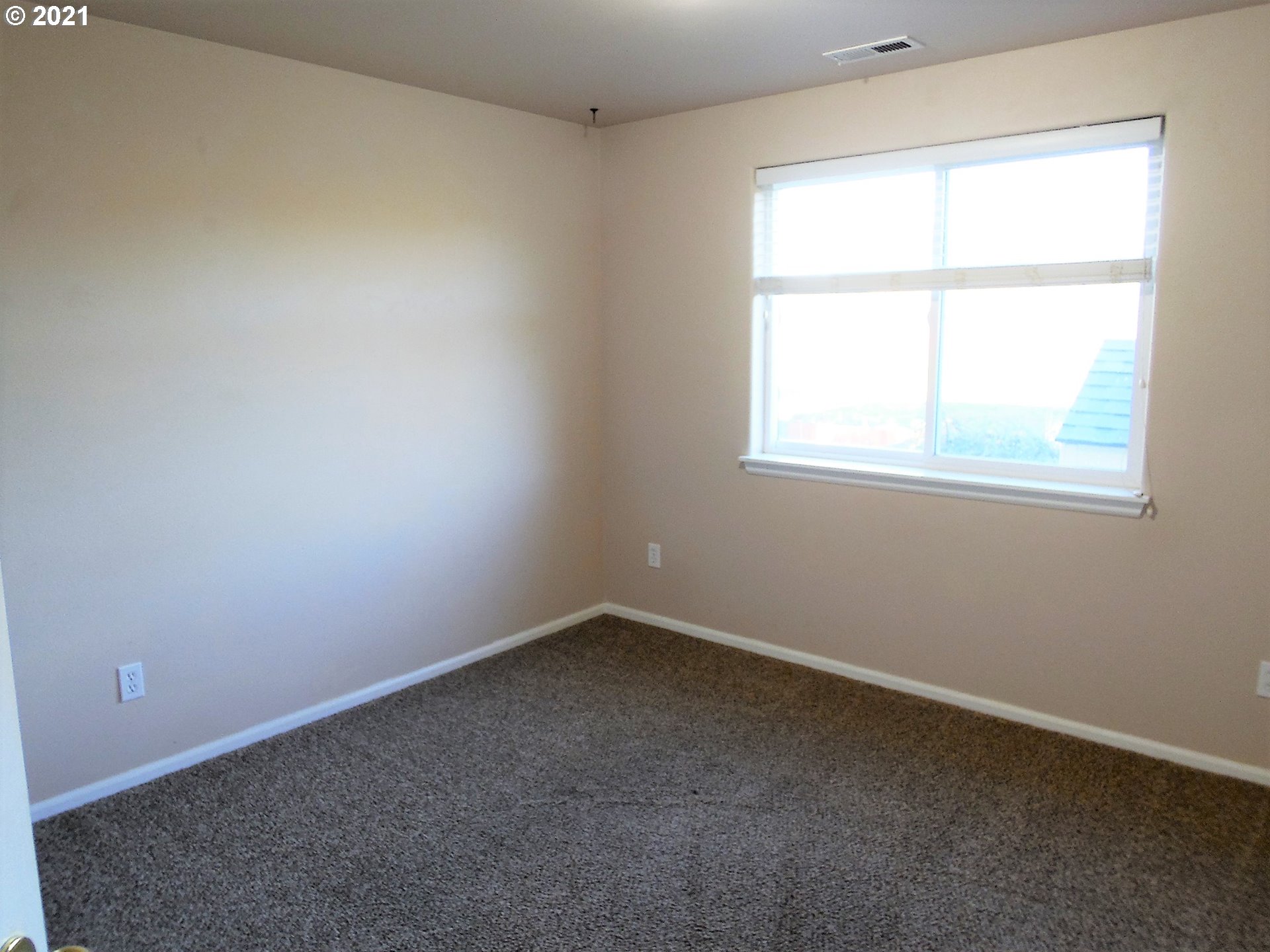 185 Lebleu Lane Winston, OR 97496 - Photo 13 of 23 an empty room with a window