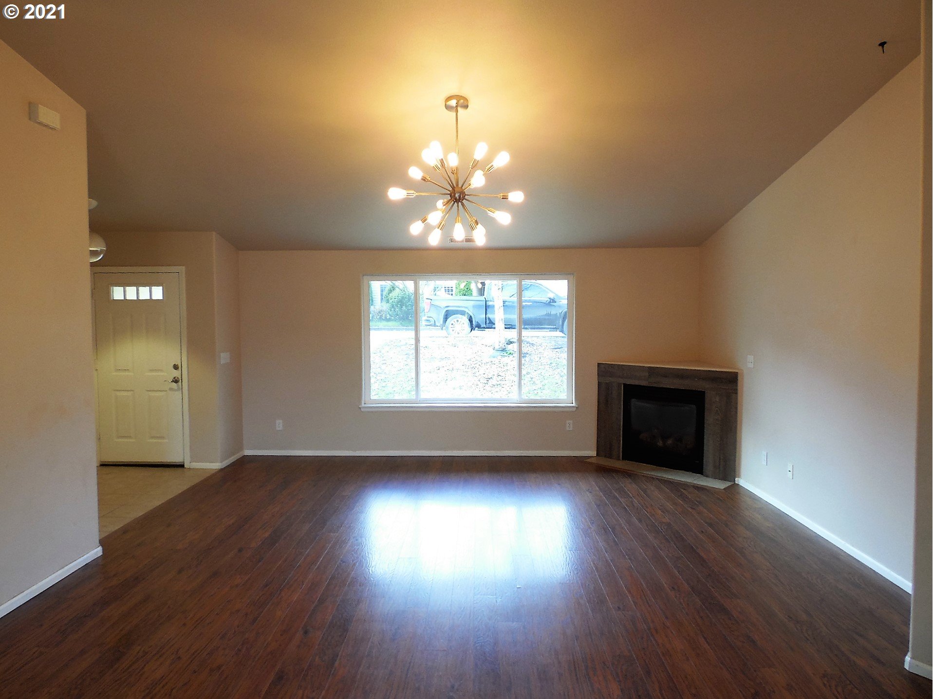 185 Lebleu Lane Winston, OR 97496 - Photo 3 of 23 a view of an empty room with wooden floor and a window