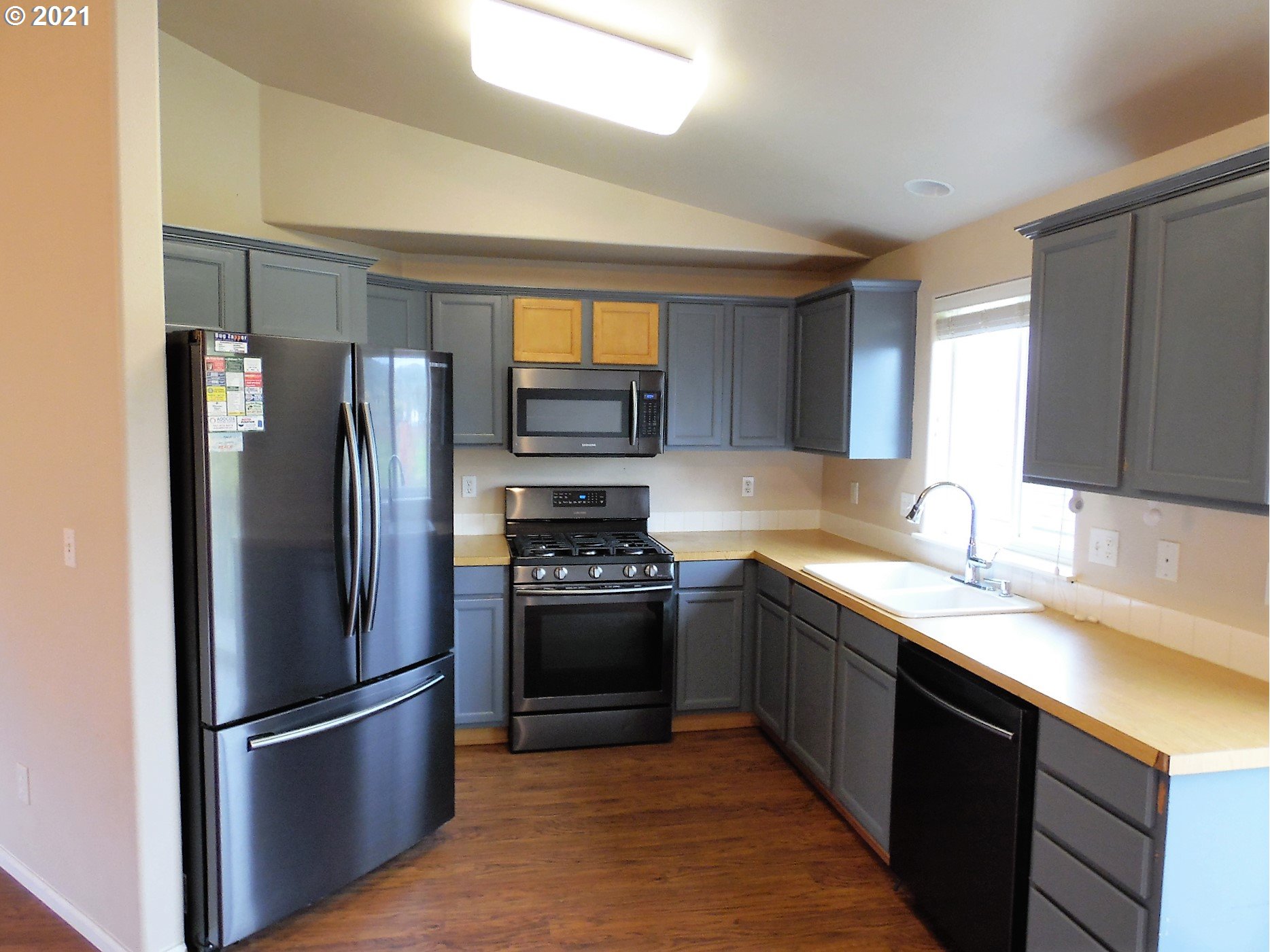185 Lebleu Lane Winston, OR 97496 - Photo 6 of 23 a kitchen with stainless steel appliances granite countertop a refrigerator stove a sink and dishwasher