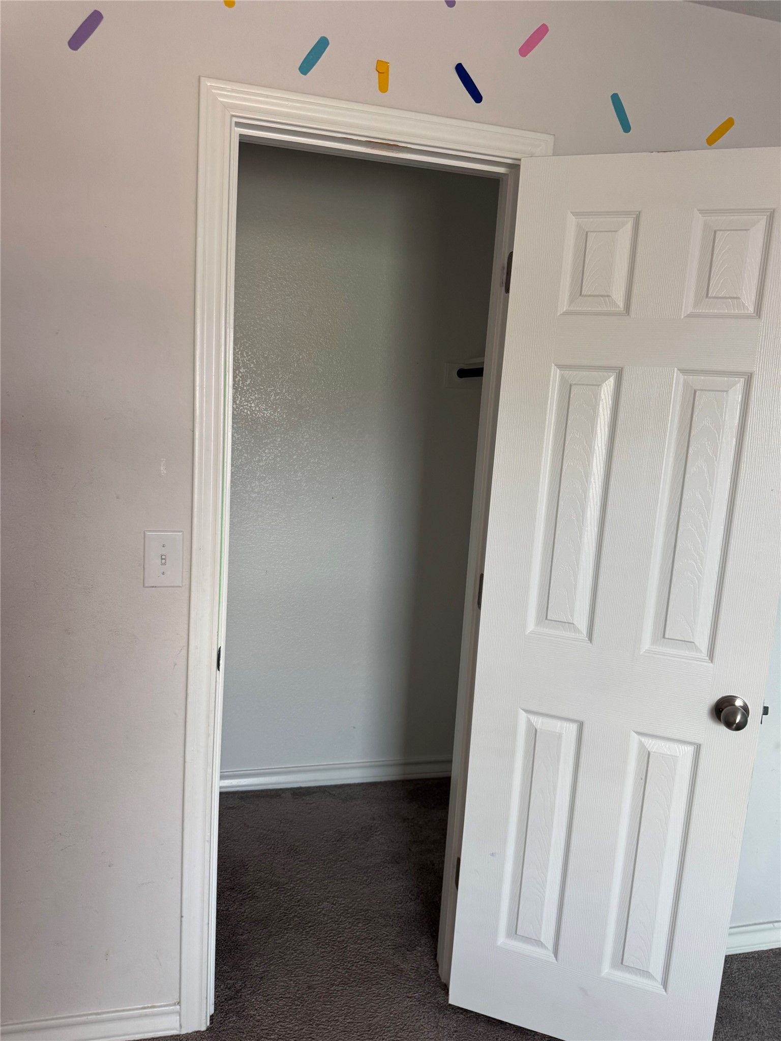 333 Capstone Road Liberty Hill, TX 78642 - Photo 30 of 40 Corridor featuring dark carpet and baseboards