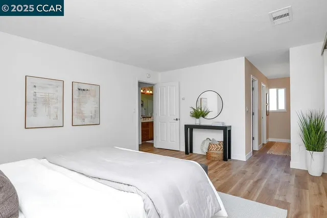 a bedroom with a bed and a fireplace