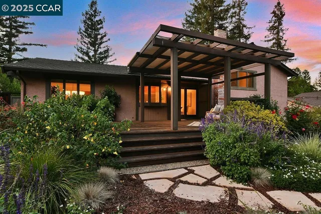 a outdoor living space with furniture and garden view