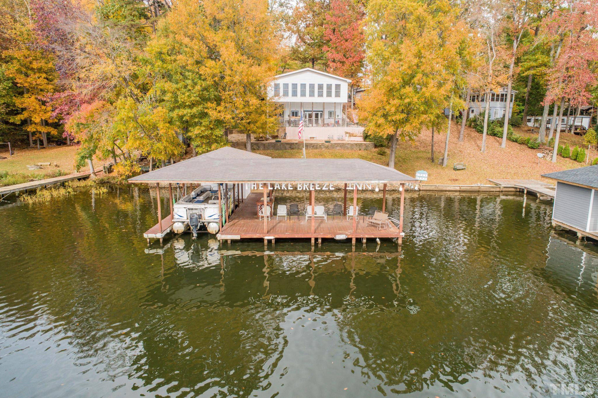 64 Fish Trail Bracey, VA 23919 - Photo 1 of 39 a view of a lake with houses
