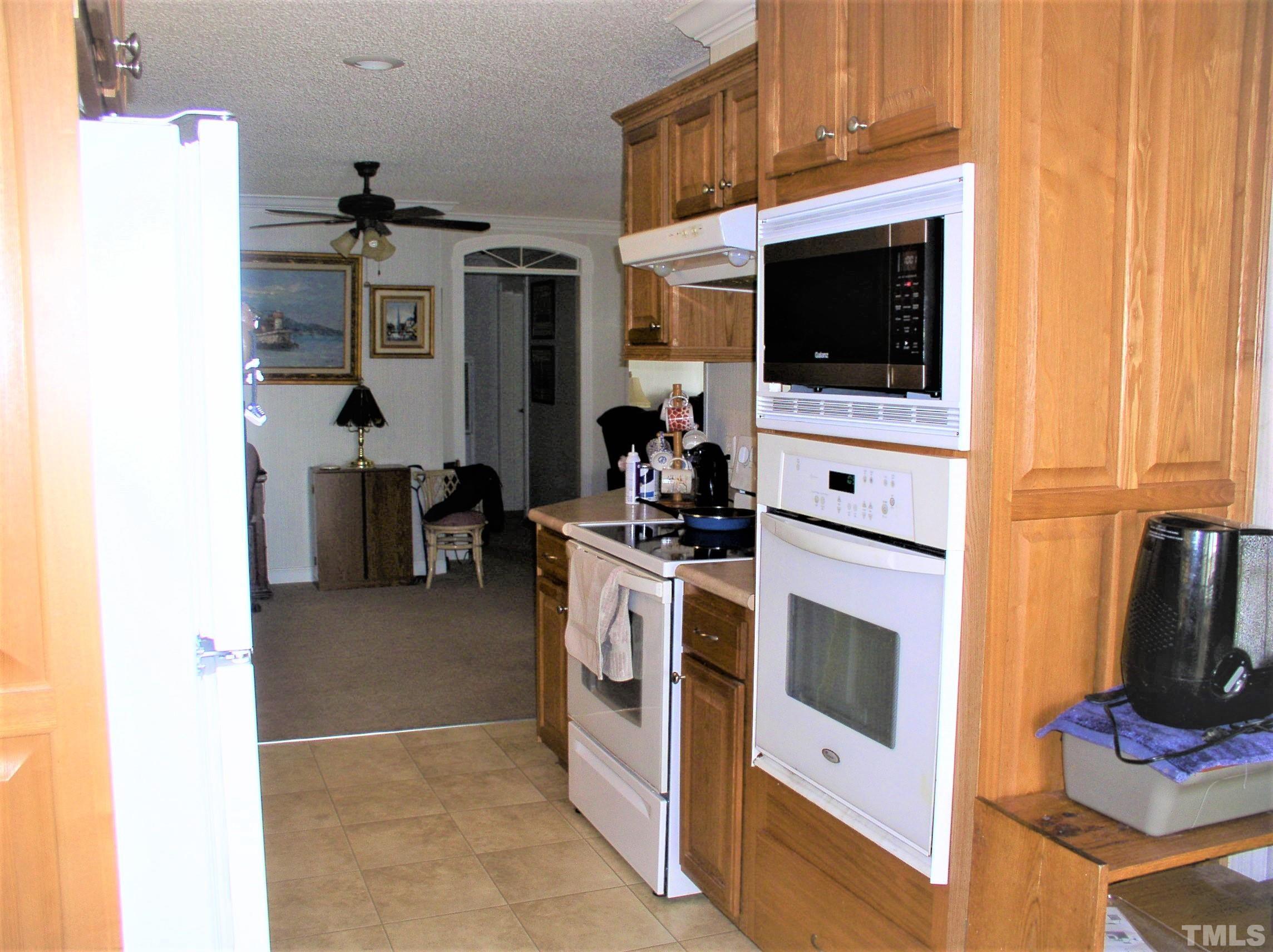 64 Fish Trail Bracey, VA 23919 - Photo 11 of 39 a kitchen with a stove and a microwave