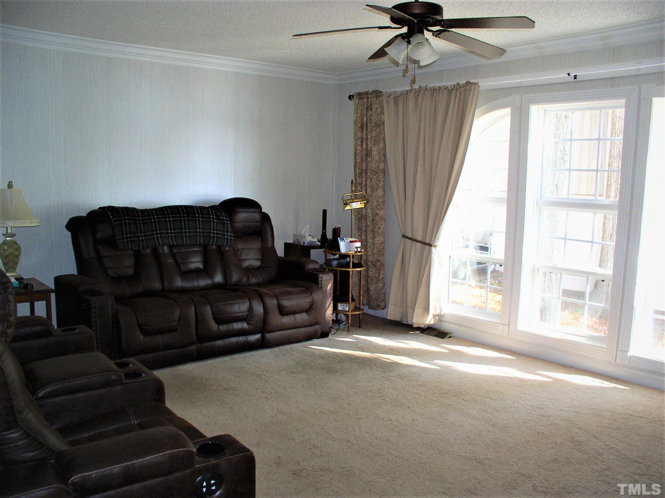64 Fish Trail Bracey, VA 23919 - Photo 14 of 39 a living room with furniture and a window