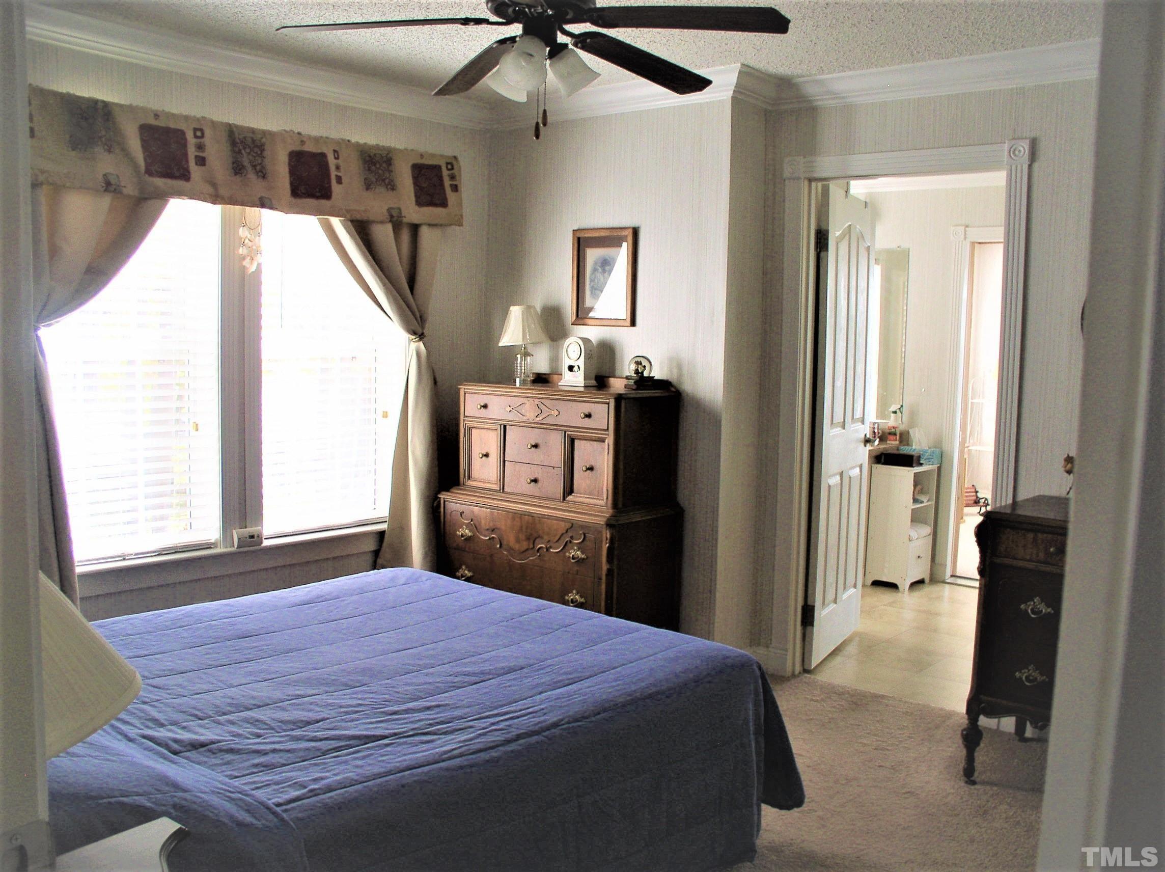 64 Fish Trail Bracey, VA 23919 - Photo 17 of 39 a bedroom with a bed and a mirror