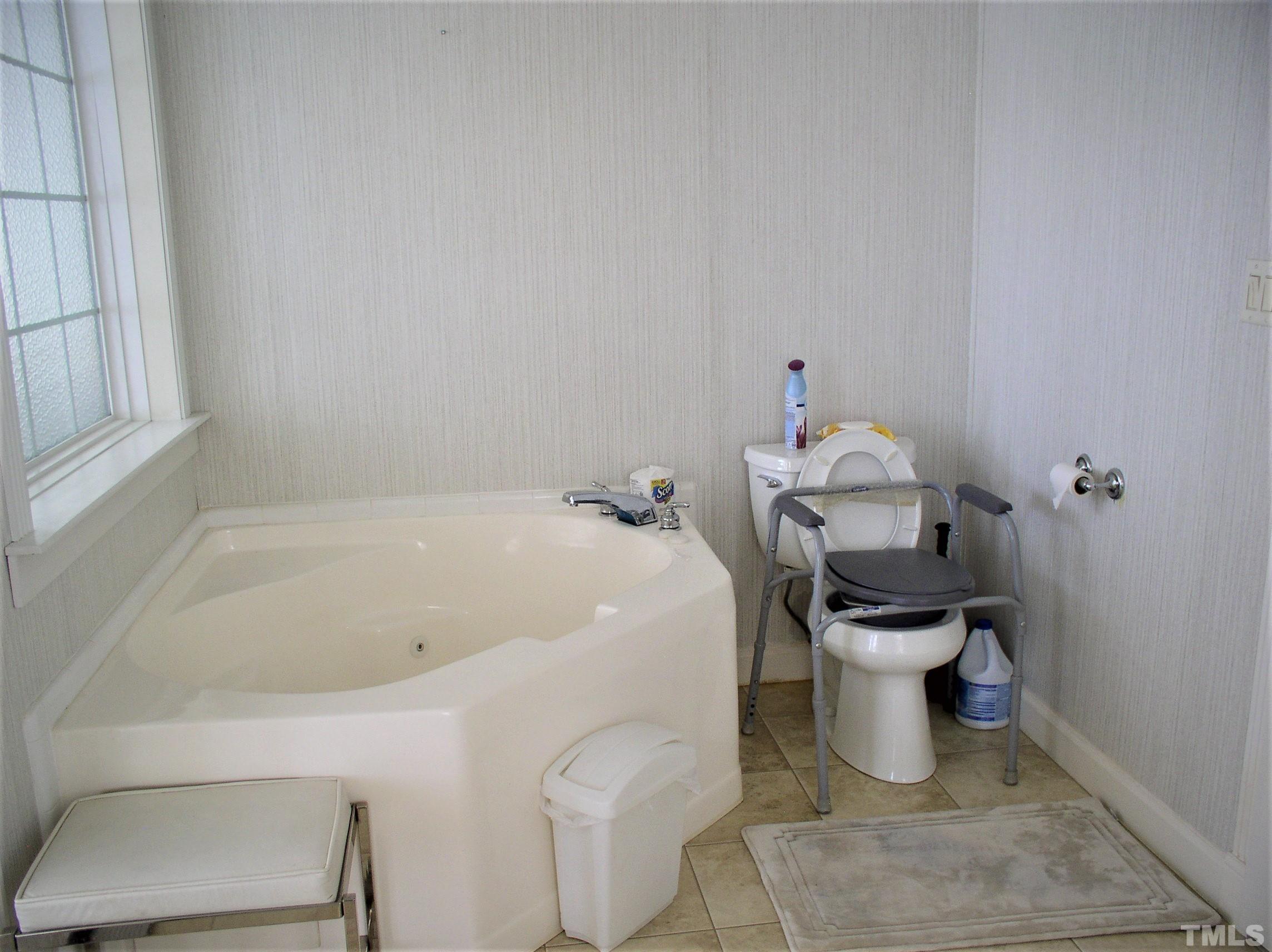 64 Fish Trail Bracey, VA 23919 - Photo 20 of 39 a white bath tub sitting next to a white toilet