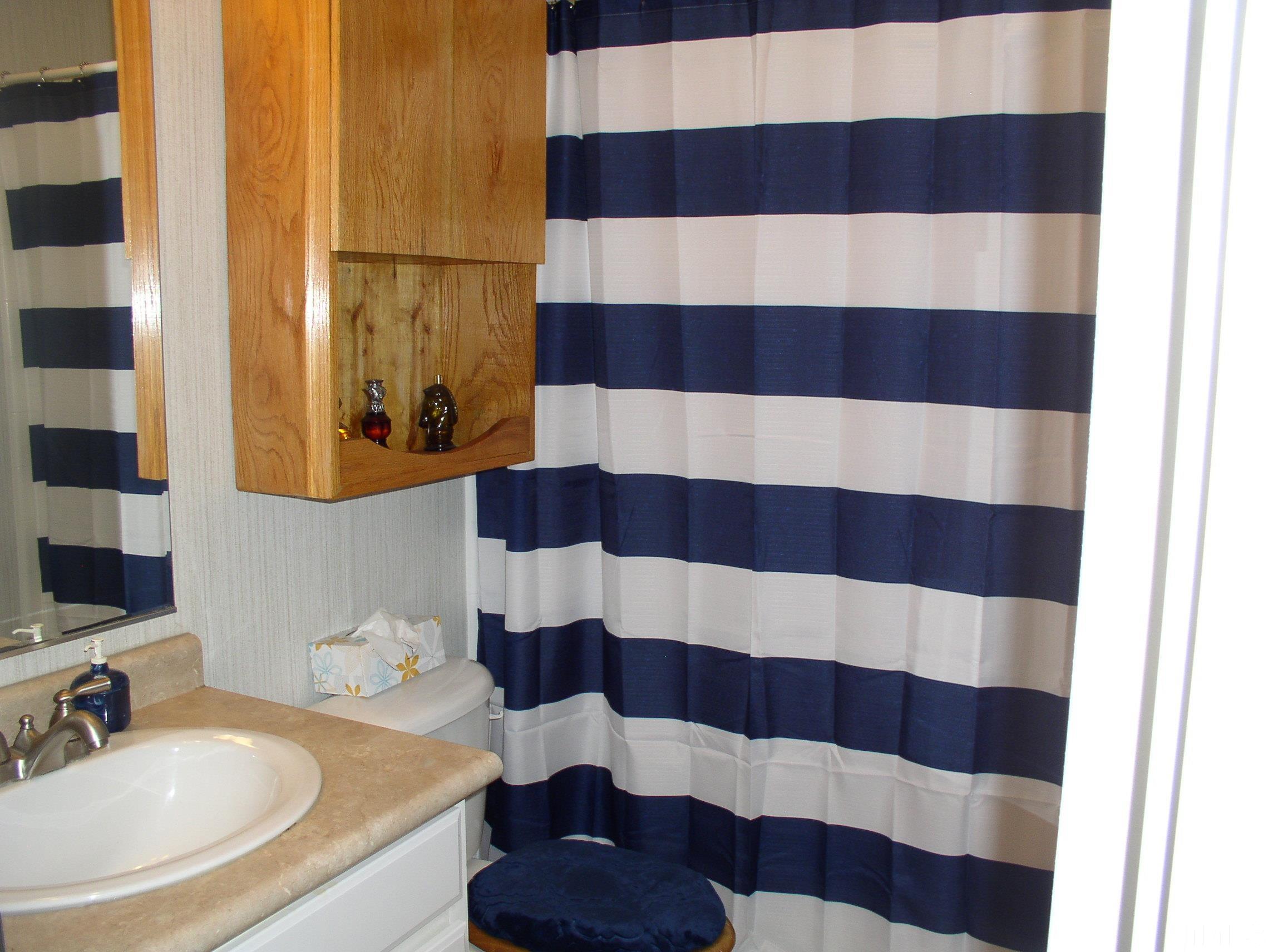 64 Fish Trail Bracey, VA 23919 - Photo 24 of 39 a bathroom with a sink a toilet and shower