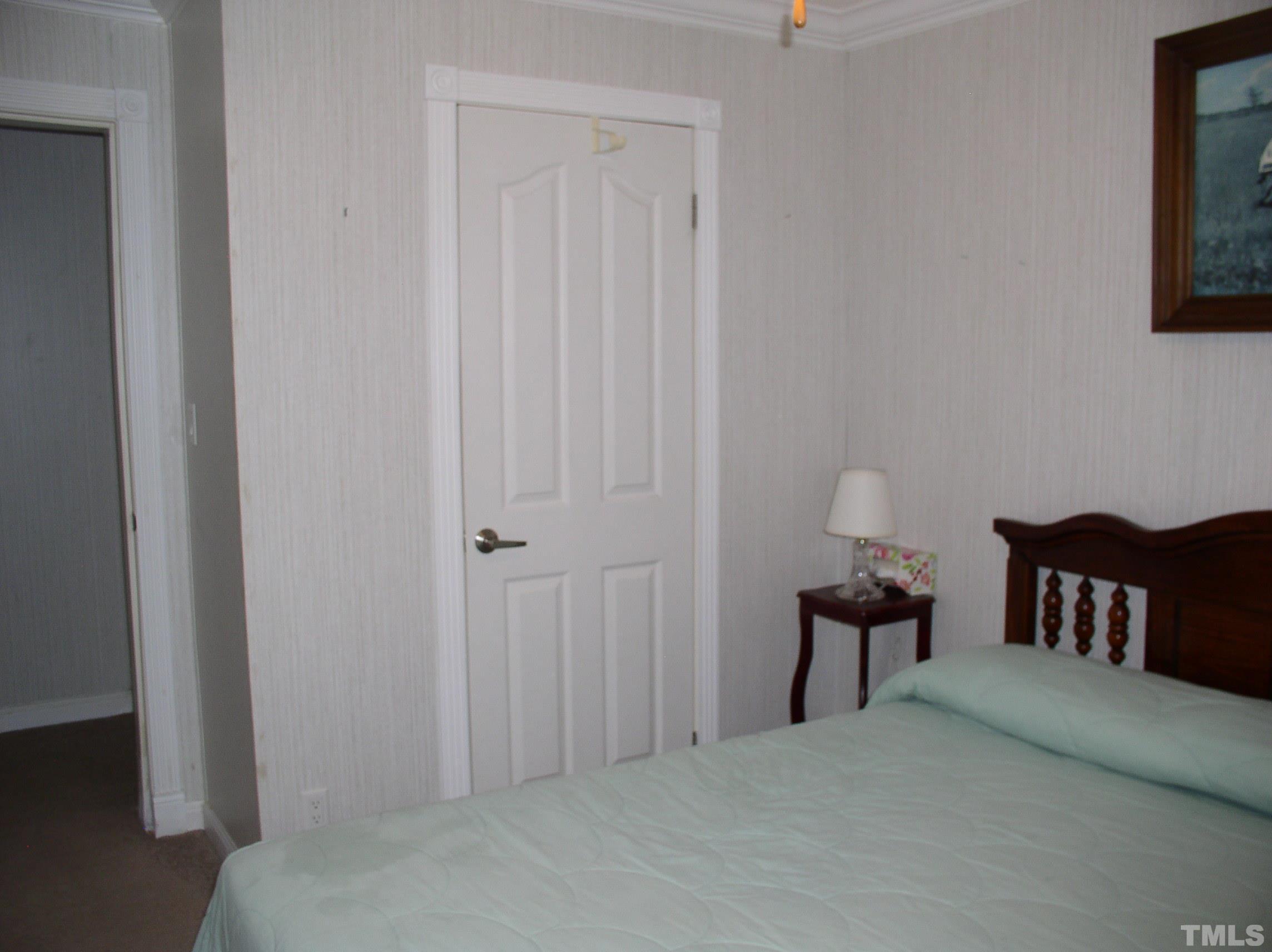 64 Fish Trail Bracey, VA 23919 - Photo 26 of 39 a bedroom with a bed and a table in it