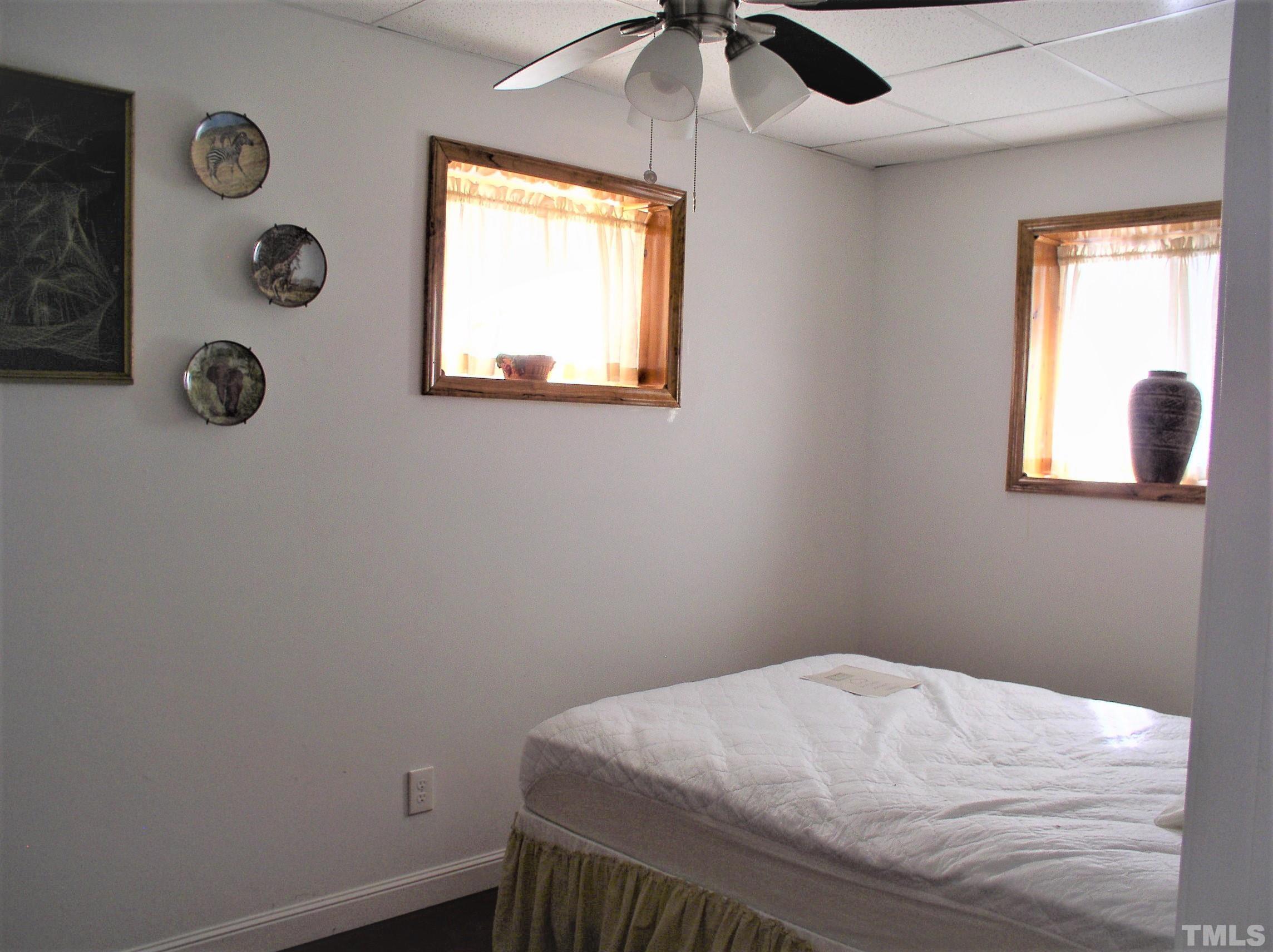 64 Fish Trail Bracey, VA 23919 - Photo 27 of 39 a bedroom with a bed and a window