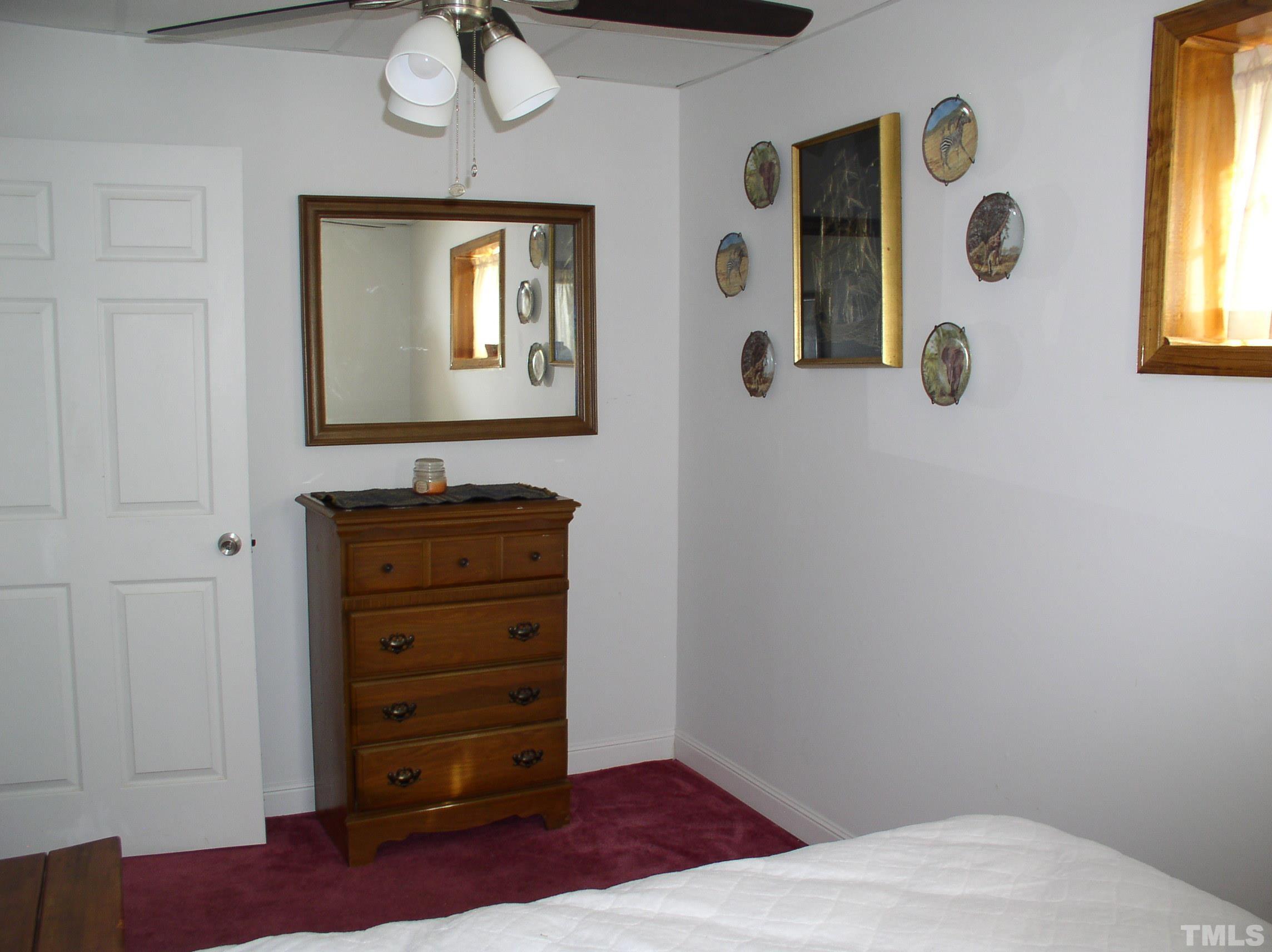 64 Fish Trail Bracey, VA 23919 - Photo 28 of 39 a bathroom with a mirror and a shower