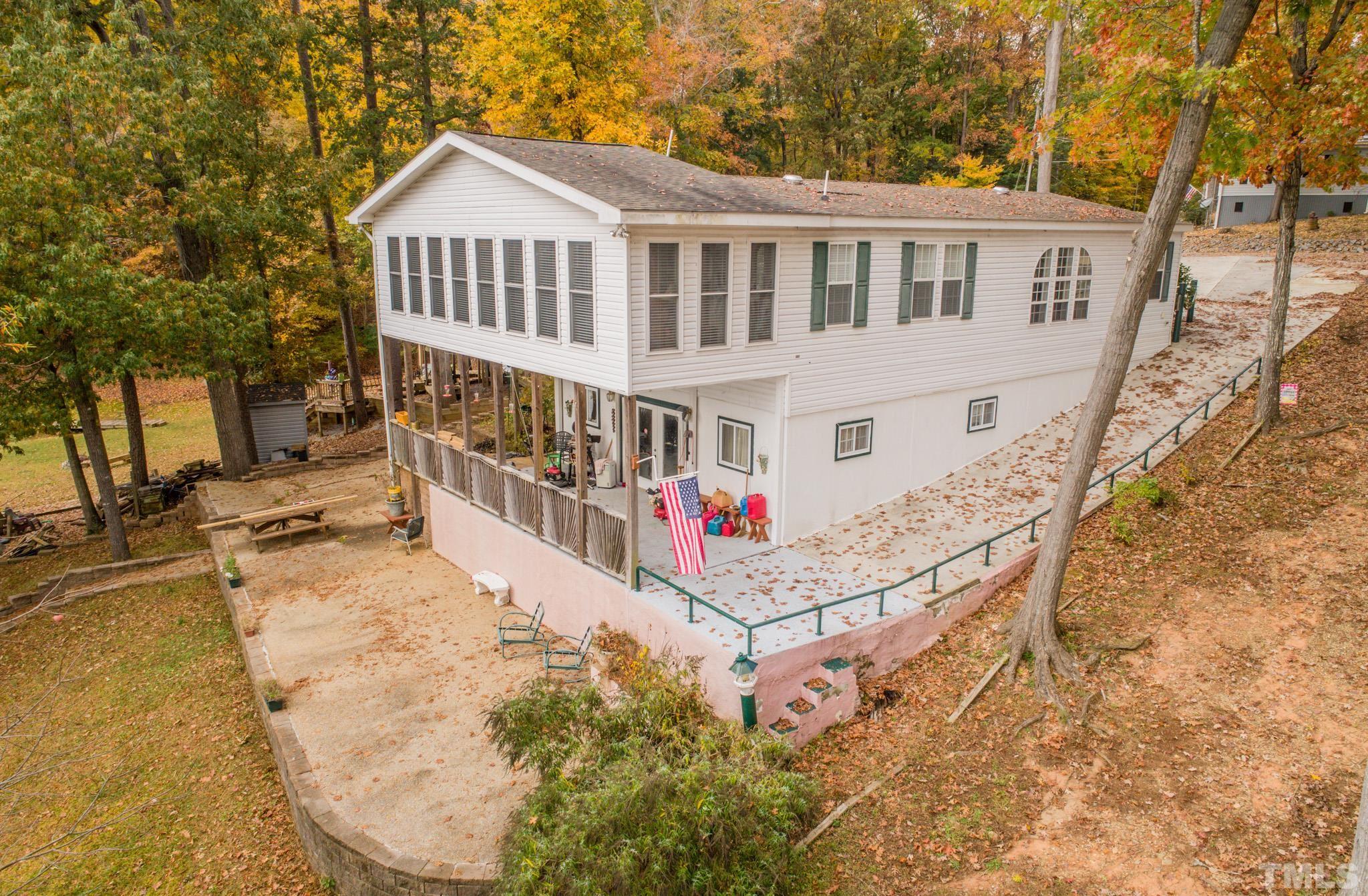 64 Fish Trail Bracey, VA 23919 - Photo 5 of 39 front view of a house with a yard