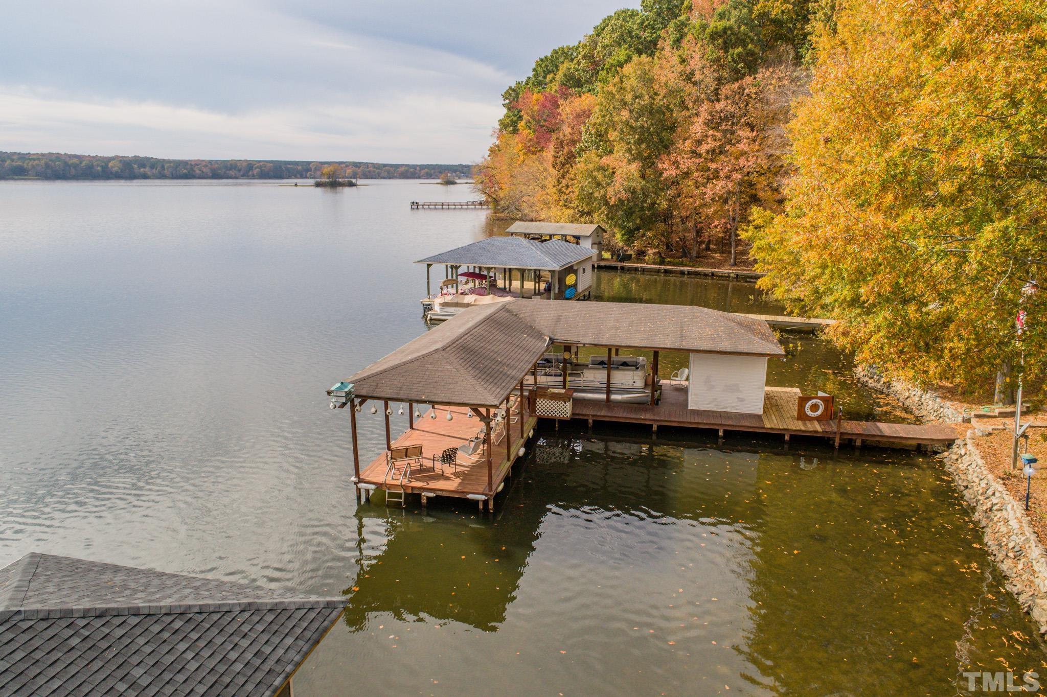 64 Fish Trail Bracey, VA 23919 - Photo 7 of 39 a small pool with a table and chairs