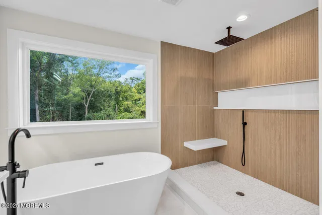a bathroom with a toilet a sink and bathtub