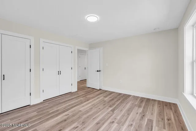 a view of room with wooden floor