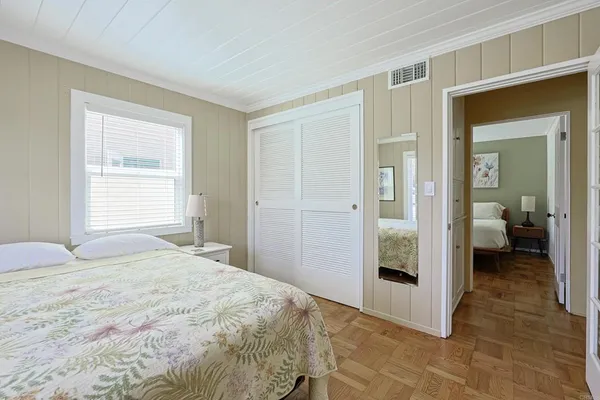 a bedroom with a bed and a bathroom