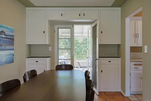 a kitchen with cabinets a sink and a window