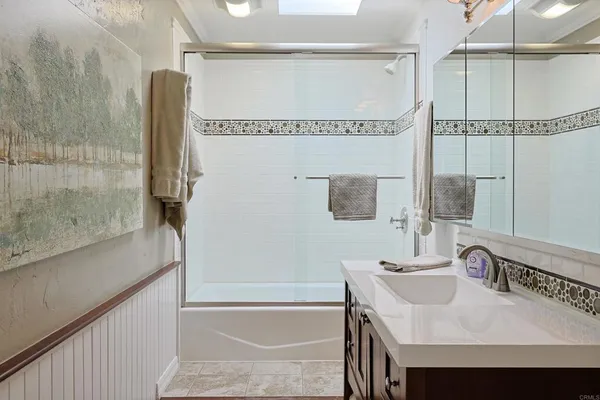 a bathroom with a sink and a shower