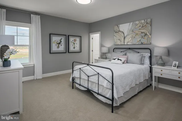 a bedroom with a bed and window